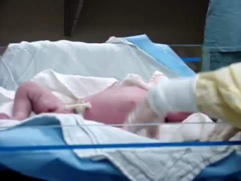 New born baby boy takes first breath of air