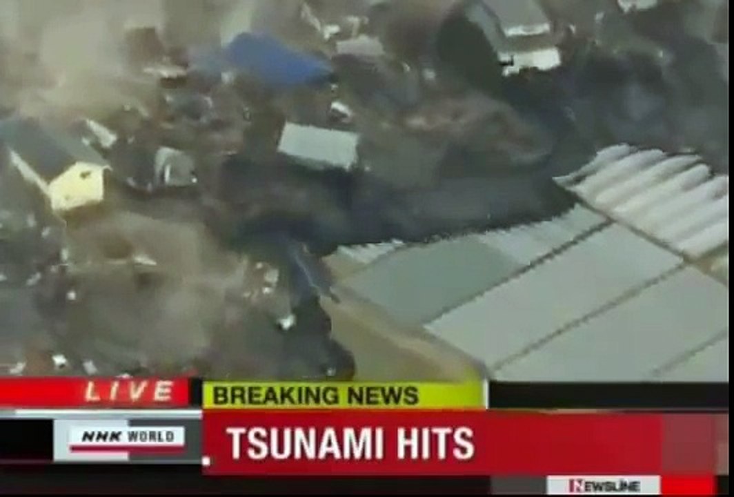 Tsunami Japan strange Object UFO coming out the sea..