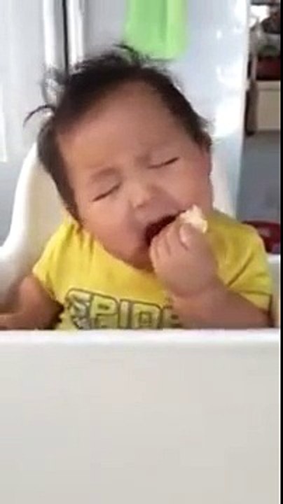 Baby eating andn sleeping at the same time!.