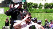 Marine and Wounded Veteran salute during Rolling Thunder
