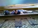 Man trapped under moving Train escapes!