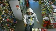 SHOCKING CCTV: Brave shopkeeper takes on gunman