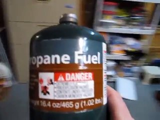 Refilling a 1lb campstove propane bottle from a 20lb grill tank.