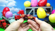 Toy cars for children in large eggs surprises  Mack Transporter and trucks