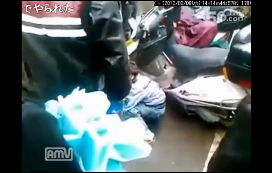 A Gang Of Racist Chinese Kicked a Little UYGHUR Boy in the Head then Broke His Hands in CHINA