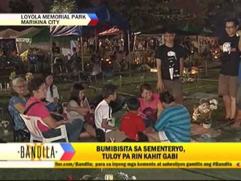 Rain pours on Loyola cemetery visitors