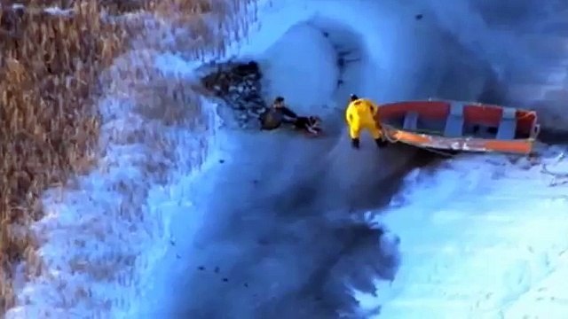 Man and dog rescued from frozen lake