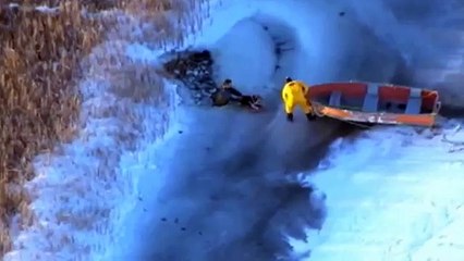 Man and dog rescued from frozen lake