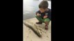 Fish flop! Little boy gets slapped in the face by Big Fish