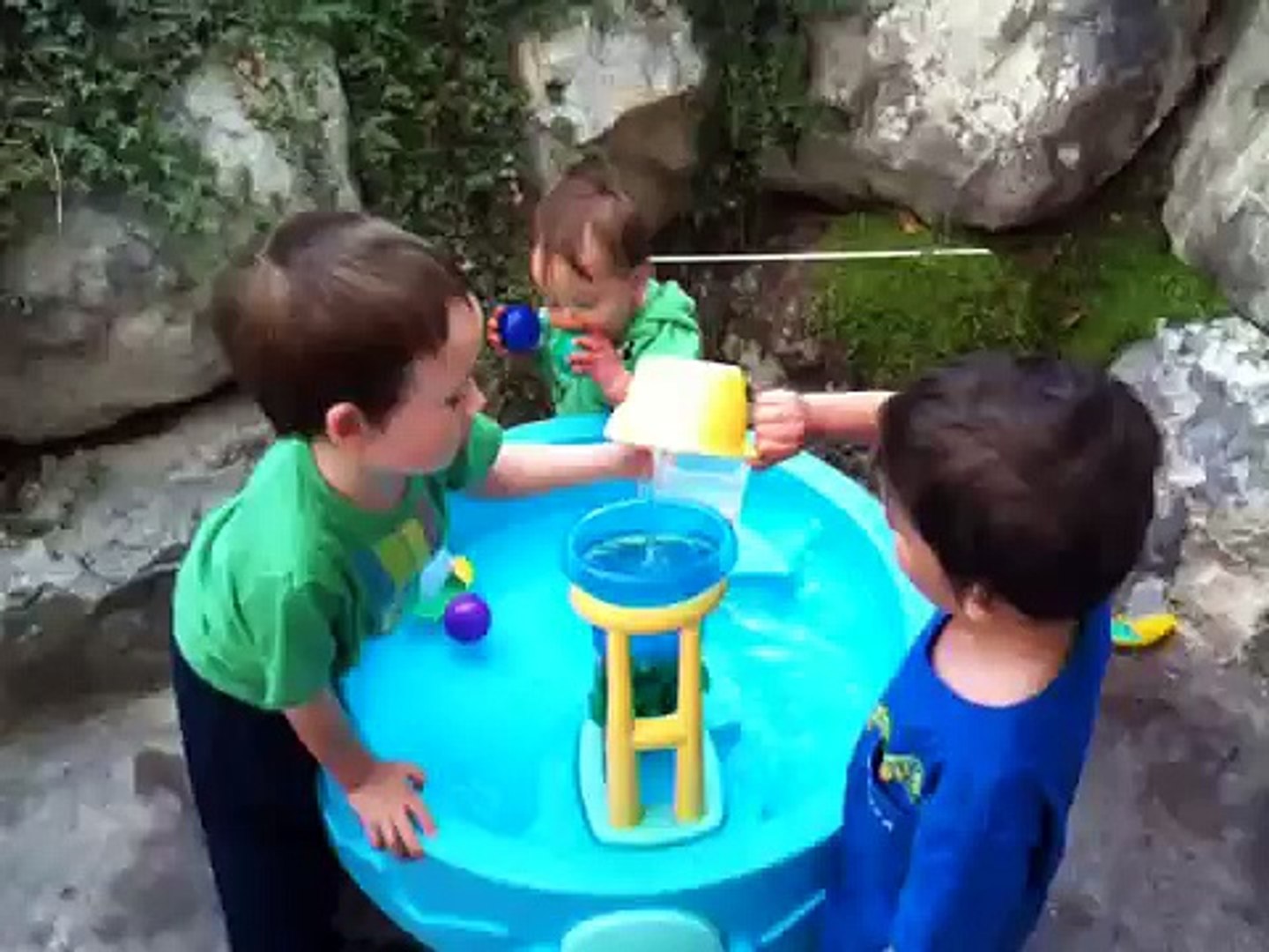 Kids playing with water table