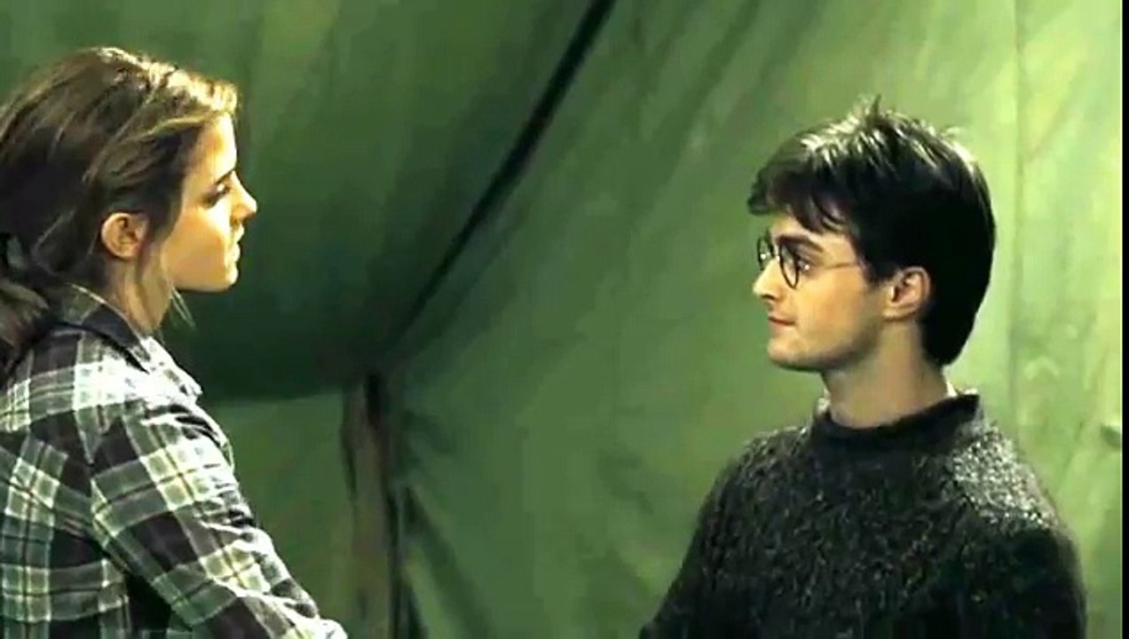 Harry dances with Hermione.