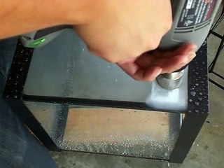 Drilling a hole through glass