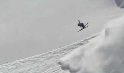 He's throwing down a backflip meanwhile an avalanche starts behind him !