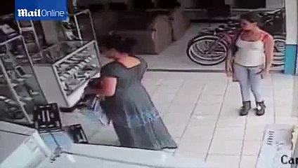 Woman stuffing a Plasma TV up her Skirt, CCTV Footage