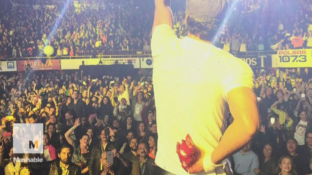 Enrique Iglesias gets bloodied fingers after trying to grab drone at concert