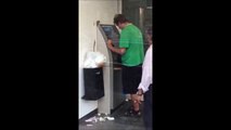Drunk guy in ATM : beer shower!