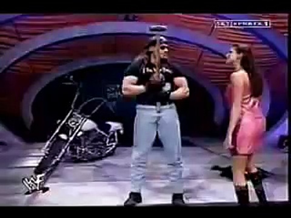 TriPle h destroys the undertaker's motor bike