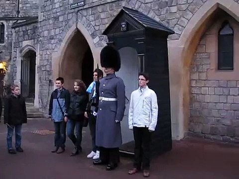 Windsor castle guard moving and pushing a teenager