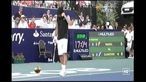Novak Djokovic mimicing Rafael Nadal in front of him