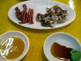 Eating live strange edible sea animals in Pusan fish market, South Korea