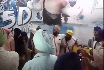 men who ripped poster made to apologize