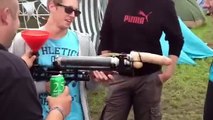 Youth experiment with the gun-dildo pitcher of beer at a festival