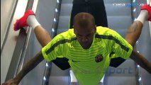 Dani Alves invents a new way to ride the escalator on the way out to Barcelona training