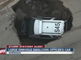 Large sinkhole swallows officer's SUV in Sheridan Colorado