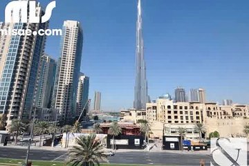 A bright two bedroom apartment with views of the Boulevard fountain   Burj Khalifa from the balcony. - mlsae.com