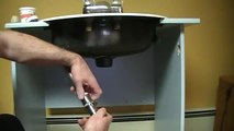 Old plumber shows how to install a bathroom sink (basin) drain.P.O.plug... plug and chain