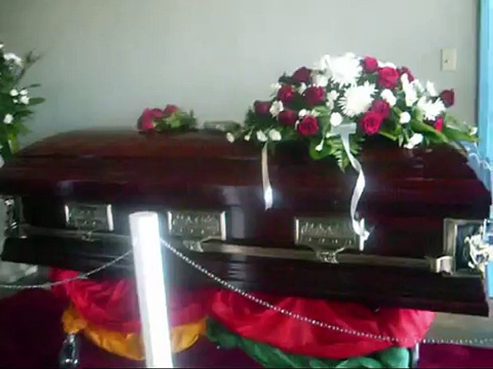 GREGORY ISAACS IN HIS CASKET AT HIS FUNERAL- IN KINGSTON,JA.