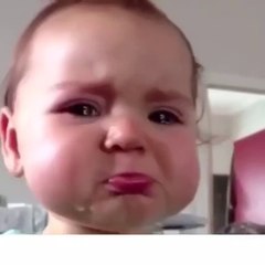 Cute baby tries not to cry