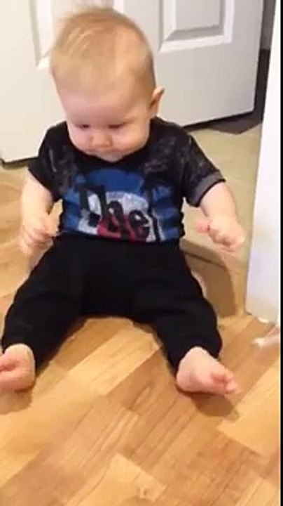 Baby mimics door stop