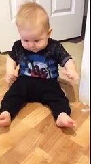 Baby mimics door stop