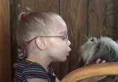 Young Girl Learns to Speak Dog Language