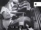 1950s secretaries at work behind the scenes in New York bank, typing and filing
