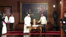 Pope Francis signs the guest book at Malacañang