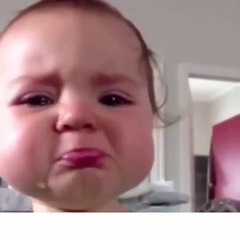 Cute baby tries not to cry