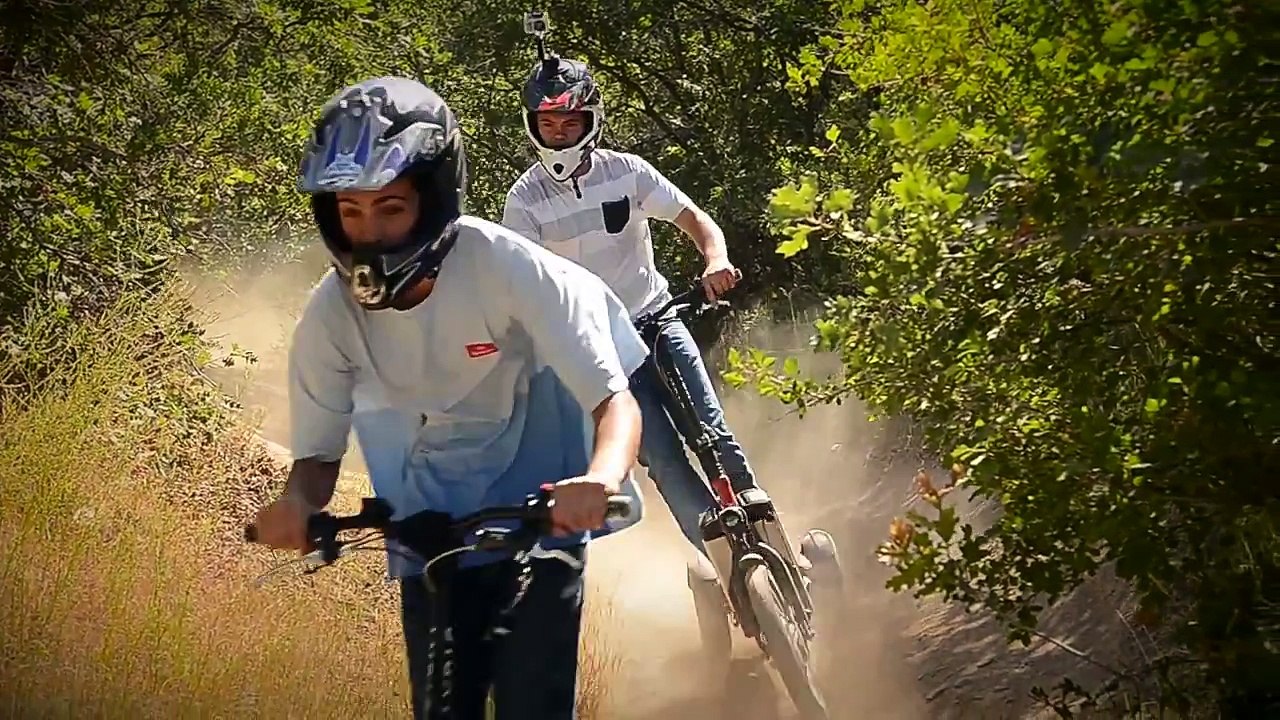 LYRIC Motion Electric Scooter: Trail riding on a mountain bike single track.