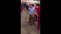 Teddy bear carrying a ma on shoulders... Lol, that's an awesome costume!