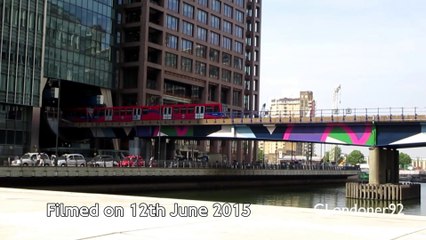 DLR train crossing Middle Dock at Canary Wharf East London