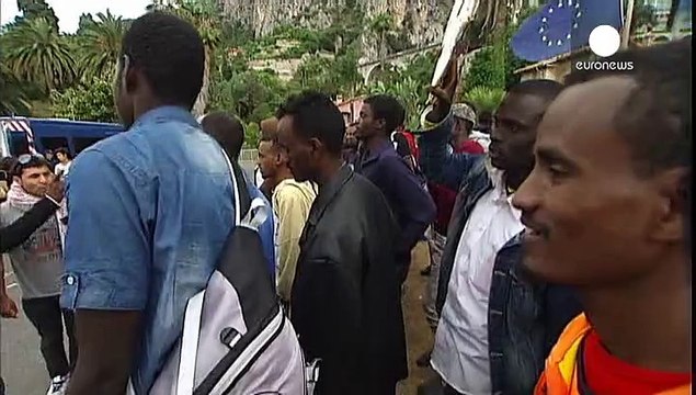 French police block African immigrants trying to cross the border from Italy