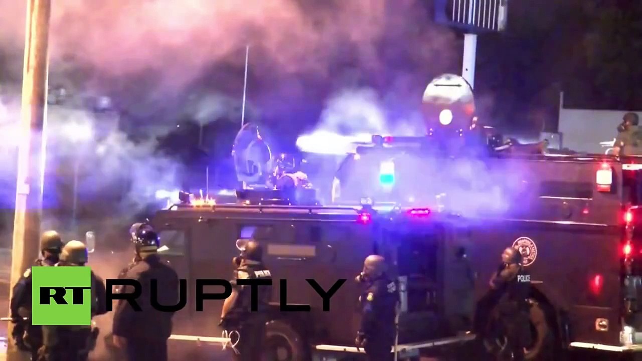 Tear gas, smoke grenades deployed as Ferguson protesters defy curfew