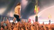 Singer catches beer while crowdwalking, drinks it, continues..