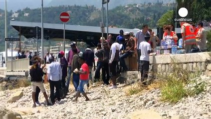Migrants refuse to go away as French police prevent them crossing the Italian frontier