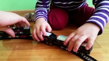 Toys train for children. Little kids open a toy train and play. Cute video for boys