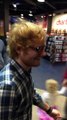 Ed Sheeran surprising a fan while she sings in front of a crowd at West Edmonton Mall