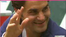 Roger Federer waving and talking to his twins after Halle victory