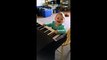 Baby extremely amused by piano playing