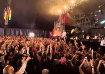 Singer Catches and Drinks Beer While Crowd Walking in Holland